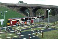 Service for Queen Street leaves Kelvindale. The fencing contractor did well at this station.<br><br>[Ewan Crawford 28/09/2005]