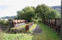 The old bridge which formerly carried the Lochaber Narrow Gauge Railway over the West Highland line in September 2005. Fort William Junction is just out of shot below left.<br><br>[John Furnevel 30/09/2005]