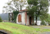 Remains of the water tower at north end of Creagan station in September 2005. Loch Creran lies beyond.<br><br>[John Furnevel 29/09/2005]