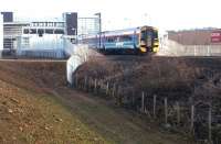 A Bathgate train westbound at Edinburgh Park in December 2003.<br><br>[John Furnevel 02/12/2003]