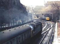 An EE Type 4 takes an Aberdeen train west through Princes Street Gardens in March 1972. The train is about to pass a Waverley bound DMU held at signals.<br><br>[John Furnevel 31/03/1972]