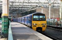 A North Berwick train awaits its departure time at Waverley platform 7 in October 2005. On the trackless platform alongside stands the Waverley Ops Depot.<br><br>[John Furnevel 17/10/2005]