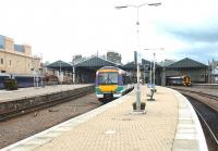 Looking back towards the concourse at Inverness in May 2002, with the London sleeper docked on the left and trains to Edinburgh (centre) and the far north line in the station.<br><br>[John Furnevel 01/05/2002]