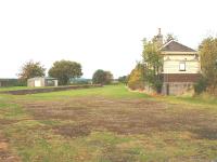 Longmorn south of Elgin on the former line to Aviemore via Craigellachie. A view of the former Goods Yard and Station Building looking north, 14/10/05.<br><br>[John Gray 14/10/2005]