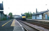 A GNER Edinburgh - London train speeds south through Acklington station, Northumberland, in May 2004.<br><br>[John Furnevel 24/05/2004]