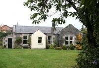 The former station at Clovenfords on the Peebles - Galashiels line  on a wet 30 October 2006. Closed in February 1962 the building is now a private residence standing in the midst of a modern housing development. [See image 34315]<br><br>[John Furnevel 30/10/2006]