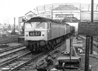 A pair of class 47s led by no 1855 heading south west through Clapham Junction with a coal train in June 1973. The train has just passed below the distinctive (and much photographed) Clapham Junction 'A' signal box, which was eventually closed in 1989 [see image 37167].<br><br>[John Furnevel 02/06/1973]