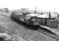 Clayton 8607 with a coal train from Dalkeith Colliery (in the background) passing Smeaton station in July 1971. View west from the road bridge. [See image 32930]<br><br>[John Furnevel 28/07/1971]