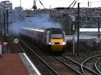 Christmas Eve 2004, with a wintry dawn having just broken over the Castle as a GNER HST heads south west out of Edinburgh on the ex-Caledonian route through Slateford.<br><br>[John Furnevel 24/12/2004]