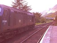 37 085 waits in the loop at Glenfinnan with a Mallaig train while an unidentified sister engine approaches with a Fort William train, August 1982.<br><br>[John Gray /08/1982]