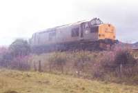 Sparks from 47 717s brakes set the embankment on fire and 37 262 <i>Dounreay</i> appeared on the scene with firefighters.<br><br>[John Gray //]