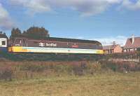 47 701 <i>Saint Andrew</i> gathers speed as it leaves Aviemore for Inverness, Summer 1990.<br><br>[John Gray //]