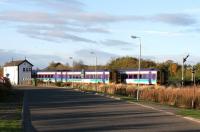 Trains for Inverness and Aberdeen crossing at Forres east during the late afternoon in November 2005.<br><br>[John Furnevel 04/11/2005]