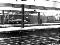 Electro-Diesel no E6033 (later 73126) stands at the head of a parcels train while final loading is completed at Waterloo station on a fine summer evening in 1969. The crew takes the opportunity to enjoy the late sunshine <br><br>[John Furnevel 21/06/1969]