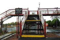 Barry Links footbridge looking west. The signalbox was formerly beyond the footbridge. The former excursion platform can be seen on the left.<br><br>[Ewan Crawford //2005]