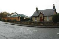 Looking north in the old station square. The station platform has been demolished and replaced with a housing estate but the station house remains.<br><br>[Ewan Crawford //2005]