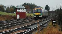 A northbound service passes Greenloaning signalbox at speed.<br><br>[Ewan Crawford /10/2005]