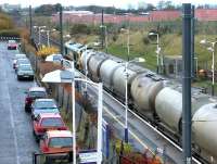 A Freightliner class 66 takes a northbound cement train through Musselburgh on 8 November 2002.<br><br>[John Furnevel 08/11/2002]