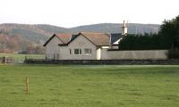 Looking south across fields towards the former Killywhan station in November 2005. The site of the level crossing is by the metal gate at the end of the platform on the far left of the picture. <br><br>[John Furnevel 09/11/2005]