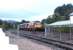 The late running Edinburgh - Inverness portion of the Highland Sleeper from Euston about to run into Aviemore station around mid-morning on 24 September 2004 behind EWS 67024. Photographed through the open gates on the link line between Network Rail and Strathspey Railway territory. <br><br>[John Furnevel 24/09/2004]