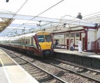 A sunny afternoon at Troon station on 3 May 2007, as SPT liveried EMU 334015 arrives with a late running service from Ayr to Glasgow Central.  <br><br>[John Furnevel 03/05/2007]