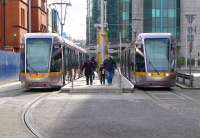 Luas trams 4006  and 4002 pass at the Busaras (Bus Station) stop on 22 March 2014.<br><br>[Bill Roberton 22/03/2014]
