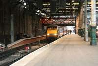 The 1400 GNER Glasgow Central - London Kings Cross calls at Waverley during major engineering works at the station on 25 November 2006. On the left the 'Klondyke' through platform being built along the station's south wall is nearing completion. This would become the new platform 10 in the subsequent renumbering.<br><br>[John Furnevel 25/11/2006]