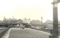 Platform view east at Partick Central on 25 July 1951, as ex-Caledonian 0-4-4T 55179 calls with a train for Possil. The booking office stands above on Benalder Street, which runs across the centre of the photograph, spanning both the railway and the River Kelvin on the right. <br><br>[G H Robin collection by courtesy of the Mitchell Library, Glasgow 25/07/1951]