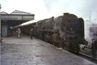 Platform scene at Carstairs on 24 July 1964 as Britannia Pacific 70011 <I>Hotspur</I> calls with a train for Manchester Victoria.<br><br>[John Robin 24/07/1964]