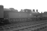 Following withdrawal from Edinburgh's Dalry Road shed at the end of 1962, McIntosh 3F 0-6-0 57550 spent a period in the yard at Bathgate 'stored awaiting disposal'. The locomotive, seen here minus various components at Bathgate in March 1964, was eventually cut up by Messrs Arnott Young, Carmyle, in June of that year. [See image 28378]<br><br>[K A Gray 28/03/1964]