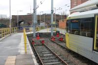 Prior to 1971 the bay platforms at Altrincham were through roads leading under the two right hand arches to the EMU Depot where the 1931 built MSJ&A dedicated sets were maintained. When the Altrincham line was converted to 25kvAC the depot closed and the site was built on. Metrolink 3024 pauses briefly in Platform 1 on 13 January 2015 before returning to Bury.<br><br>[Mark Bartlett 13/01/2015]