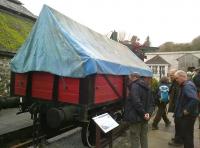 A group of Branch Line Society members inspecting a traditional china clay <I>'hood'</I> at Wheal Martyn museum, St Austell, on 28 November 2014. The Lee Moor Tramway signal box [see image 50052] stands in the background.<br><br>[Ken Strachan 28/11/2014]