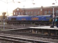 66750 still in <I>'Rush Rail'</I> livery but with GBRf branding, stands at the south end of Doncaster station on 13 January. The locomotive is hauling a train of bogie box wagons loaded with aggregate from Swinden Quarry on the Grassington branch, destined for the Lafarge facility at Small Heath, Birmingham     <br><br>[David Pesterfield 13/01/2015]