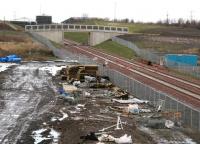 Looking north east towards Millerhill on 18 January from the road overbridge at Shawfair station. On the horizon are various structures which have recently appeared as part of the under-construction Edinburgh & Midlothian recycling plant now accessible from Whitehill Road [see image 50067]. In between is another of the new bridges now spanning the Borders Railway. <br><br>[John Furnevel 18/01/2015]