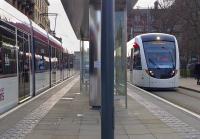 Edinburgh trams 268 and 262 pass at St Andrew Square tram stop on 20 January 2015.<br><br>[Bill Roberton 20/01/2015]