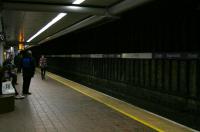 The drab decor on Glasgow Central Low level platform 17 since the yellow panels have been removed. Platform 16 on the other side retains its panels for now. Perhaps a colourful tulip motiv will be forthcoming on the change of franchise?<br><br>[Colin McDonald 20/01/2015]