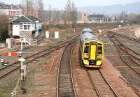 An early afternoon Perth - Edinburgh service passes Stirling North signal box on 30 March 2007. On the extreme right of the picture part of the route to Alloa can just be seen curving away to the east. The Alloa line officially reopened some 14 months later in May 2008 [see image 19427].<br><br>[John Furnevel 30/03/2007]