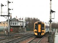 158728 about to enter Stirling station from the south on 29 January 2005 with an early afternoon Edinburgh - Dunblane service. The train is passing Stirling Middle signal box and some of its associated semaphores [see image 24505].<br><br>[John Furnevel 29/01/2005]