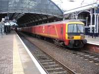 Royal Mail EMU 325015 stands at signals alongside platform 4 at Newcastle Central on 13 January 2015. The unit was returning to Tyne Yard following driver training along the north end of the East Coast route in advance of planned diversions during February. <br><br>[David Pesterfield 13/01/2015]