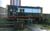 Diesel shunter 08568, which has been located at St Rollox for some years, seen through the mesh fence from the Tesco car park on 24 January 2015.<br><br>[Colin McDonald 24/01/2015]