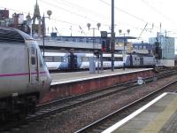 East Coast HST power car 43319 stands alongside platform 4 at Newcastle Central on 13 January following the early arrival of the 0755 ex Inverness <I>Highland Chieftain</I> to Kings Cross. In the  background 43367 leads the 10.00 ex Kings Cross <I>Northern Lights</I> service out of platform 2 on the 4 hour journey to Aberdeen.<br><br>[David Pesterfield 13/01/2015]