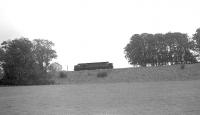 An EE Type 4 running light engine on the embankment to the east of Kelso. Thought to have been photographed looking south from the B6350 circa 1962. The line east of Kelso closed completely in 1965. [Ref query 6880]<br><br>[Bruce McCartney Collection //1962]