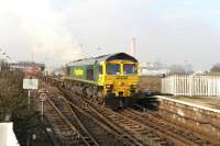 Freightliner 66516 about to passing through Didcot station from the Bristol direction with a container train on 22 January 2015. Note the recent changes to the Oxfordshire skyline [see image 44038].<br><br>[Peter Todd 22/01/2015]