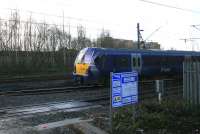 334025 on an Edinburgh - Milngavie service begins the descent to High Street station and the low level tunnel section of the line on 24th January 2015. The tracks of the little used City of Glasgow Union Railway which crosses the Clyde can be seen behind.<br><br>[Colin McDonald 24/01/2015]