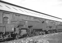 Withdrawn locomotives lined up alongside Eastleigh shed on 25 September 1963. Nearest the camera is Maunsell <I>W</I> Class 2-6-4T 31916, which had been withdrawn from here two months earlier.<br><br>[K A Gray 25/09/1963]