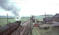 Britannia 70035 <I>Rudyard Kipling</I> takes a Liverpool / Manchester train south from Carstairs past the former Strawfrank Junction on 15 July 1966. <br><br>[John Robin 15/07/1966]