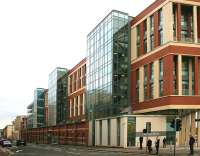 View east along Duke Street from the junction with High Street on 27 January 2015 showing the surviving wall of High Street goods station incorporated within the new property developments. <br><br>[Colin McDonald 27/01/2015]