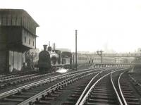 Caley 0-6-0 57631 at Rutherglen in March 1956 with a train for Balloch.<br><br>[G H Robin collection by courtesy of the Mitchell Library, Glasgow 10/03/1956]