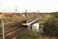 Regional Railways 3 car 150 with 150149 and a carriage from a 150/2 in the middle, heads along the down slow line towards Preston just north of Farington Junction in the early 1990s.<br><br>[John McIntyre 11/04/1992]