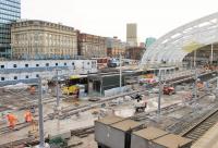 An Altrincham bound double tram picks its way carefully through the Manchester Victoria <I>re-building site</I> on 2nd December 2014. In January Metrolink announced that Victoria would re-open to trams on 18th February 2015. Although further work will still be required to complete the station project fully passengers will be able to catch trams from here again instead of having to walk to Shudehill.   <br><br>[Mark Bartlett 02/12/2014]